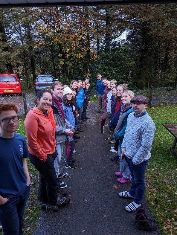 A group of people walking on a path
Description automatically generated with low confidence